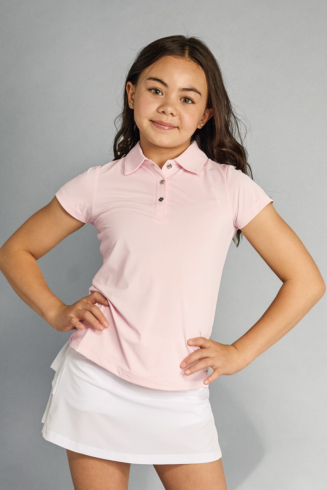 Front view of Garb Brighton girls’ youth polo in light pink.